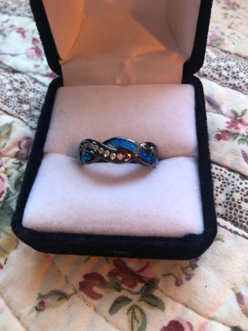 Black gold plated opal blue ring